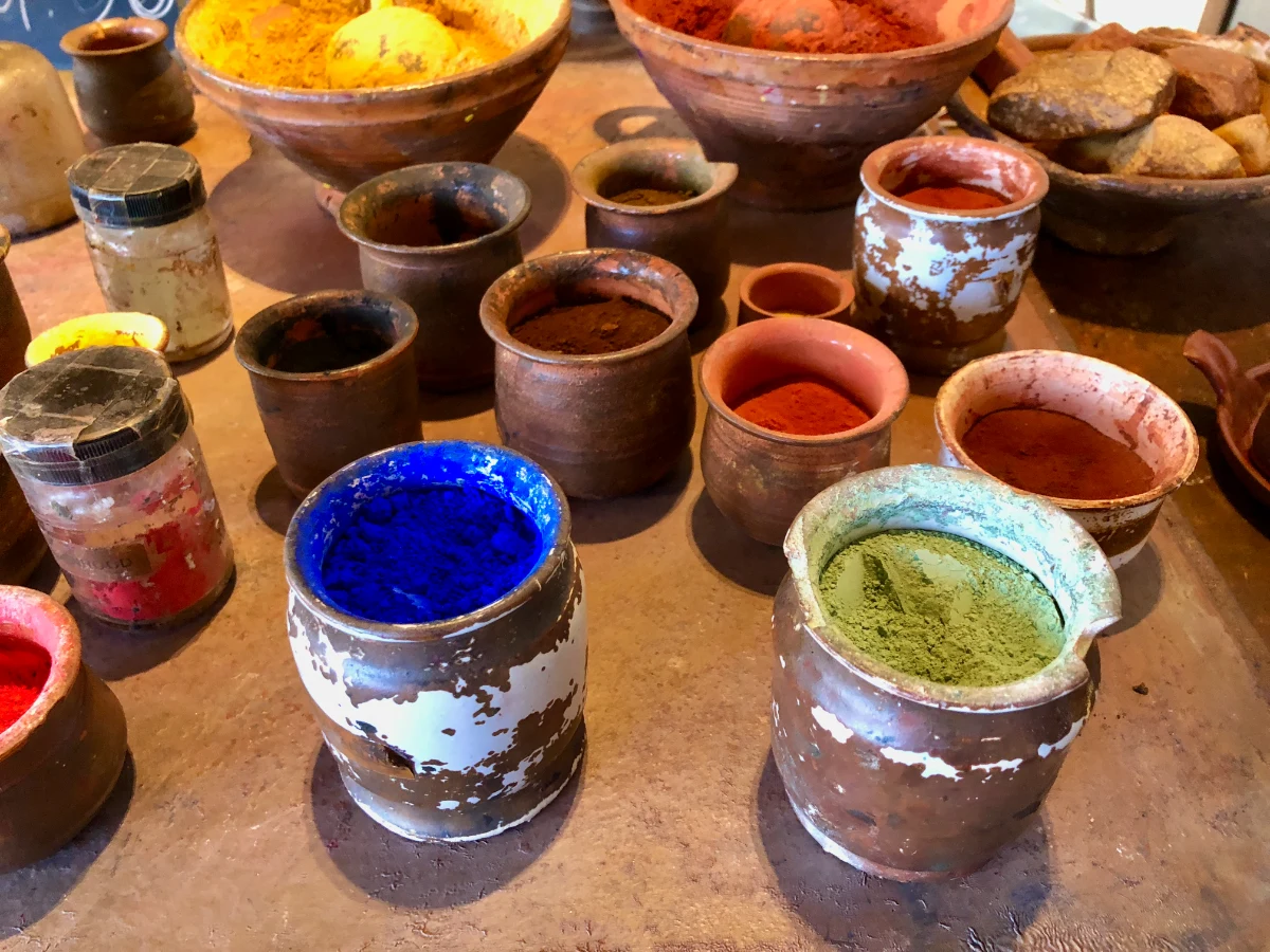 Clay pots with brightly colored pigments used for painting